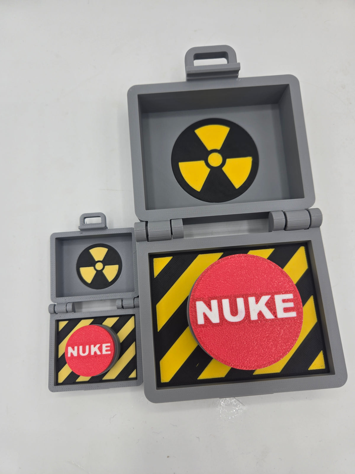 Top Secret Briefcase Nuclear Mechanical Key Fidget Clicker 3D print full-size and mini keychain sizes side by side, both open showing red NUKE clicker buttons