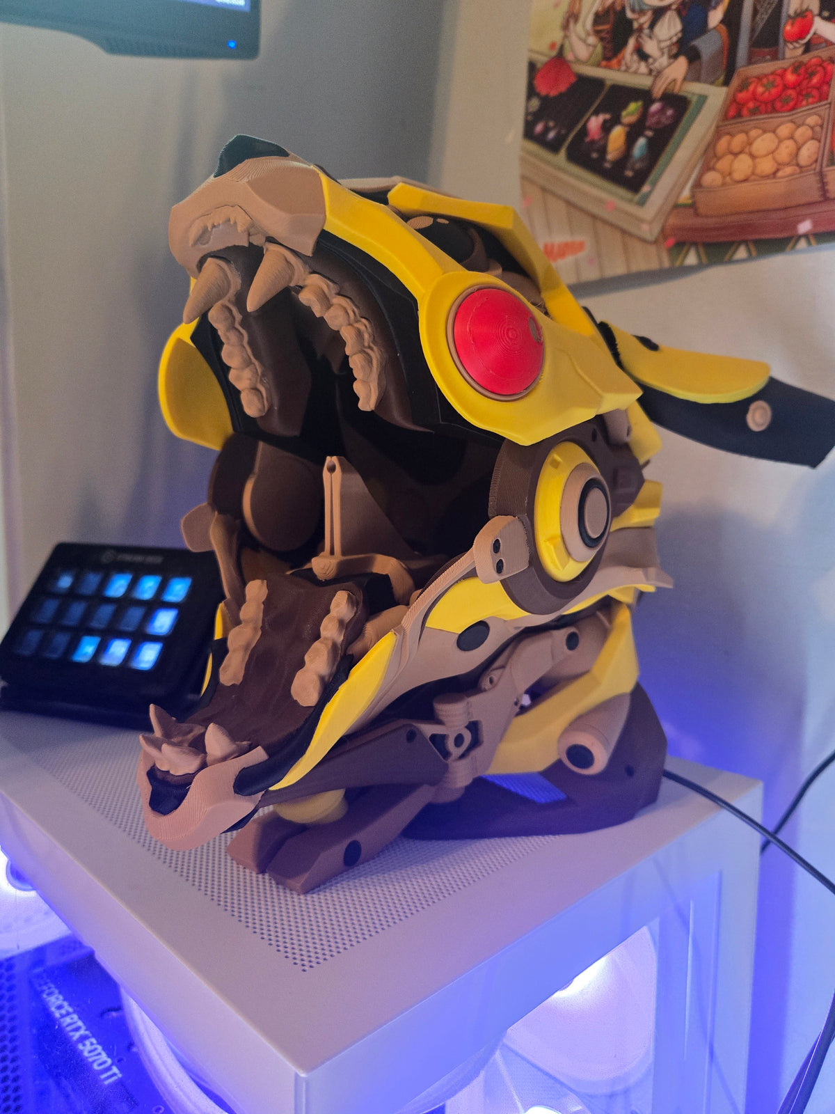 Mekachu Mecha Monster controller holder 3D print displayed on a gaming PC desk setup with purple LED lighting, jaw open, side view