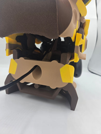 Mekachu Mecha Monster controller holder 3D print rear view showing the cord hole in the back panel with a charging cable routed through to the controller