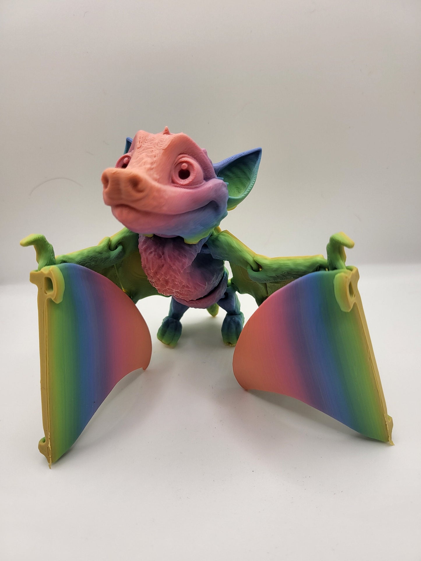 Fruit bat figurine seen from above