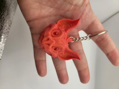 Close-up of bat keychain clasp and wing articulation detail