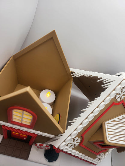 Holiday Gingerbread House Display with the roof lifted off — interior space holding LED tealight candles, 3D printed two-piece design