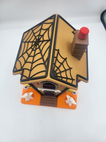 Halloween Gingerbread House top-down view of the removable spiderweb roof and chimney — 3D printed lid lifts off for lights or candy storage