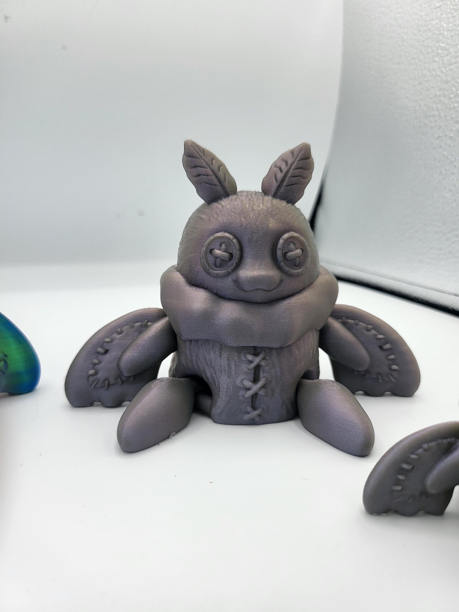 Plushie Mothman in multiple color options including classic black