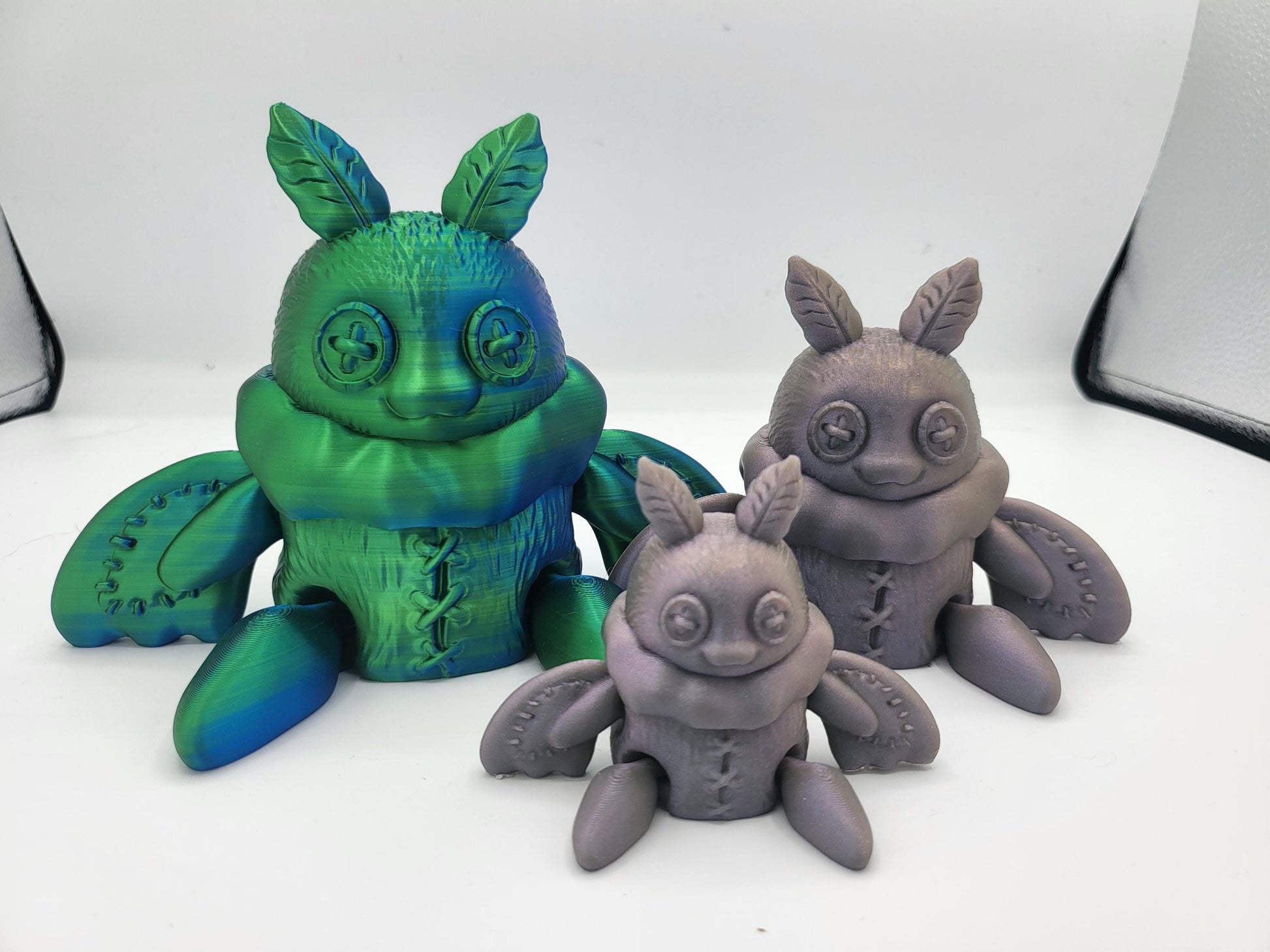 Plushie Mothman side view showing rounded poseable wing detail