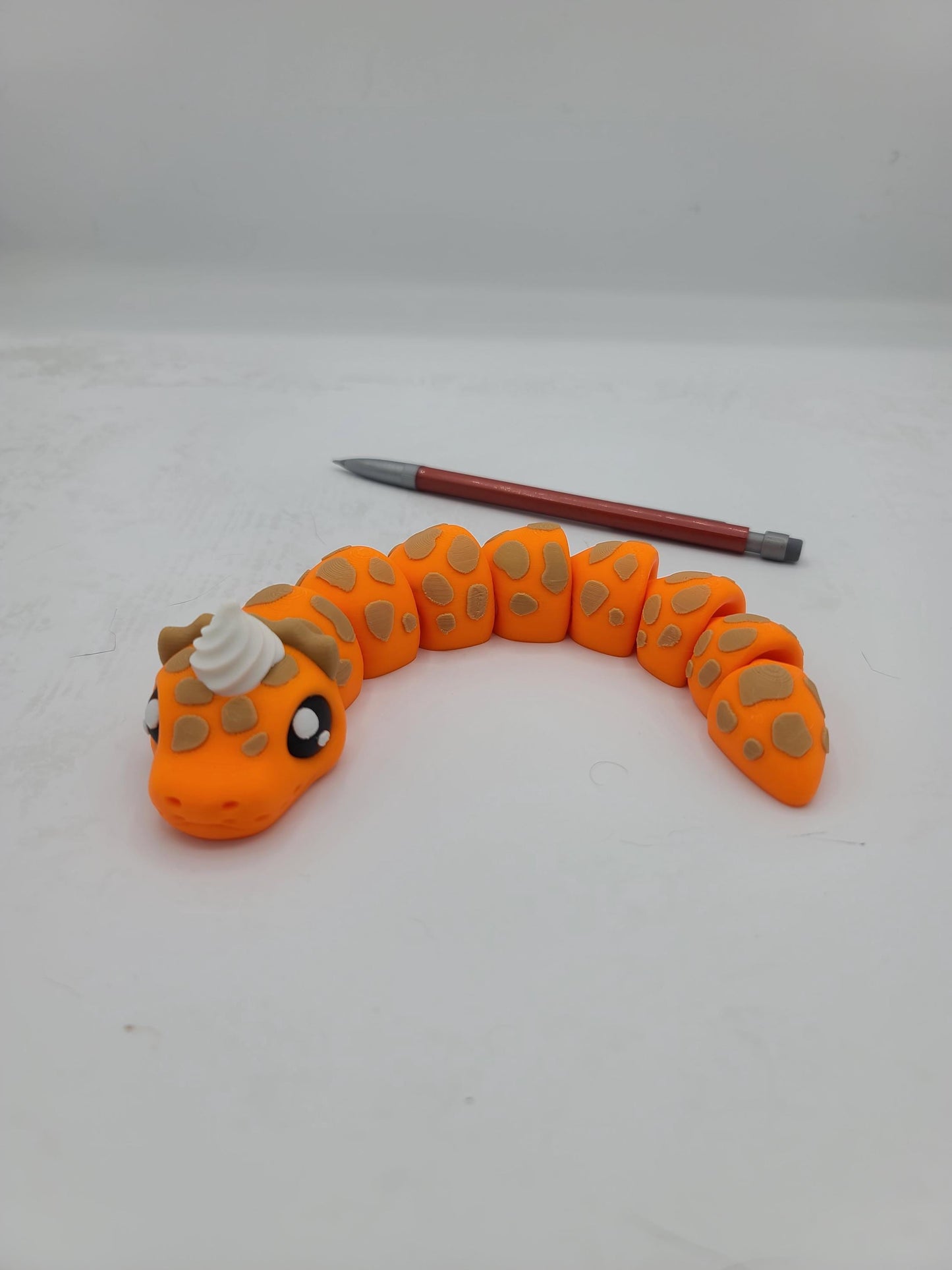 Pumpkin PIE-thon Flexi Snake 3D Print Orange Body with Beige "Crust" Spots and a Dollop of whipped cream