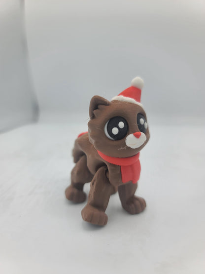 Cocoa Kitty in the Santa Hat style standing alone — brown 3D printed flexi cat with red scarf, white muzzle, and Santa hat