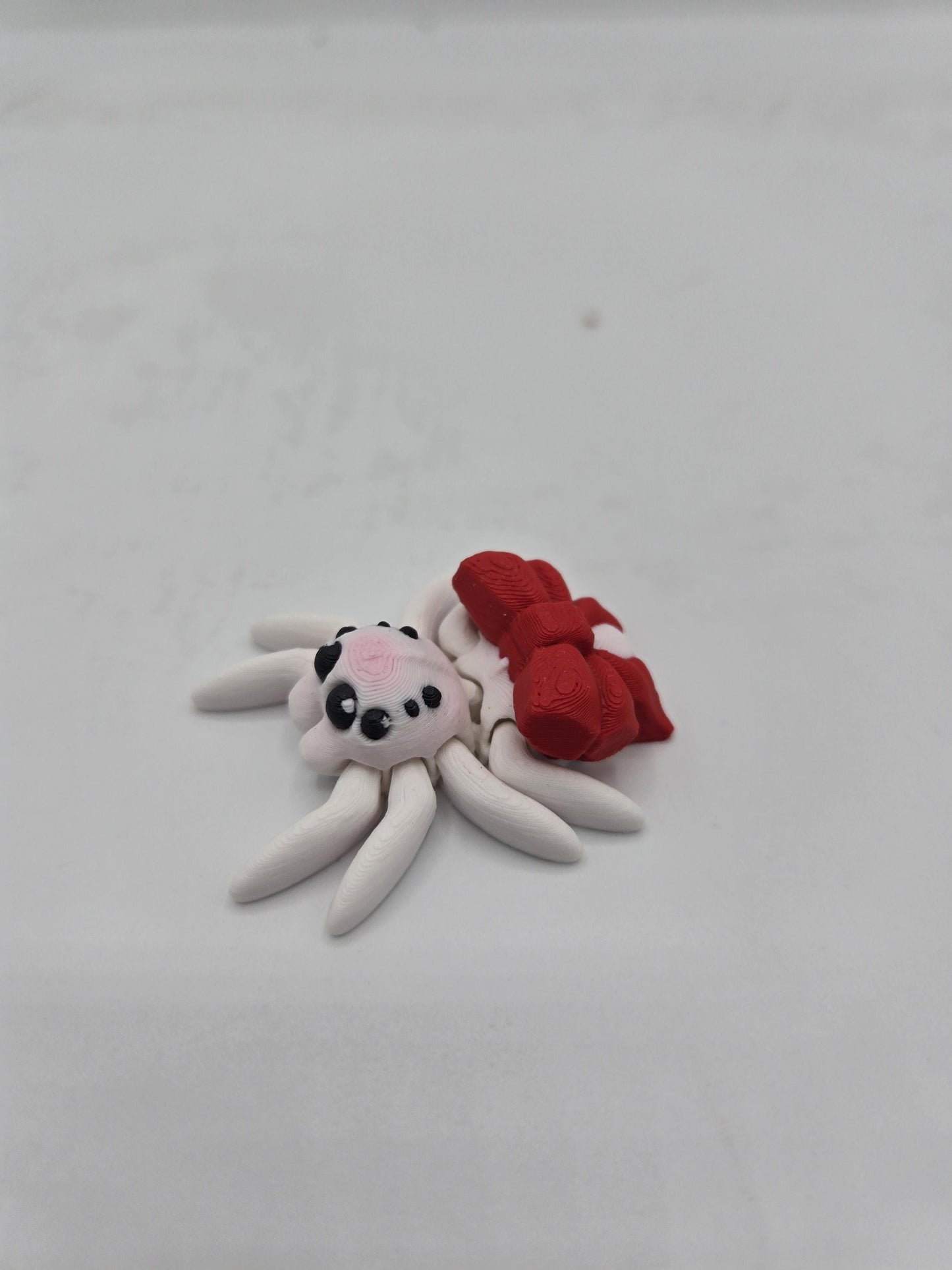 Tiny Cute Articulated Christmas Ribbon Spiders 3D Print