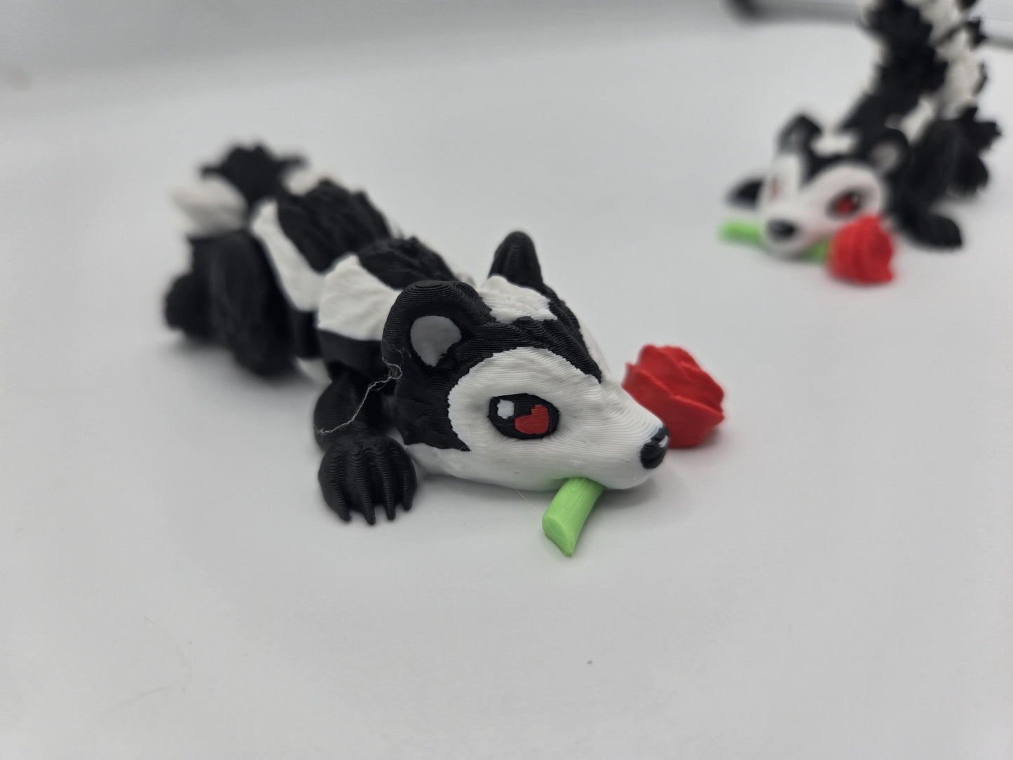 Flexi Cute Heart Eyes Flower Holding Skunk 3D Print