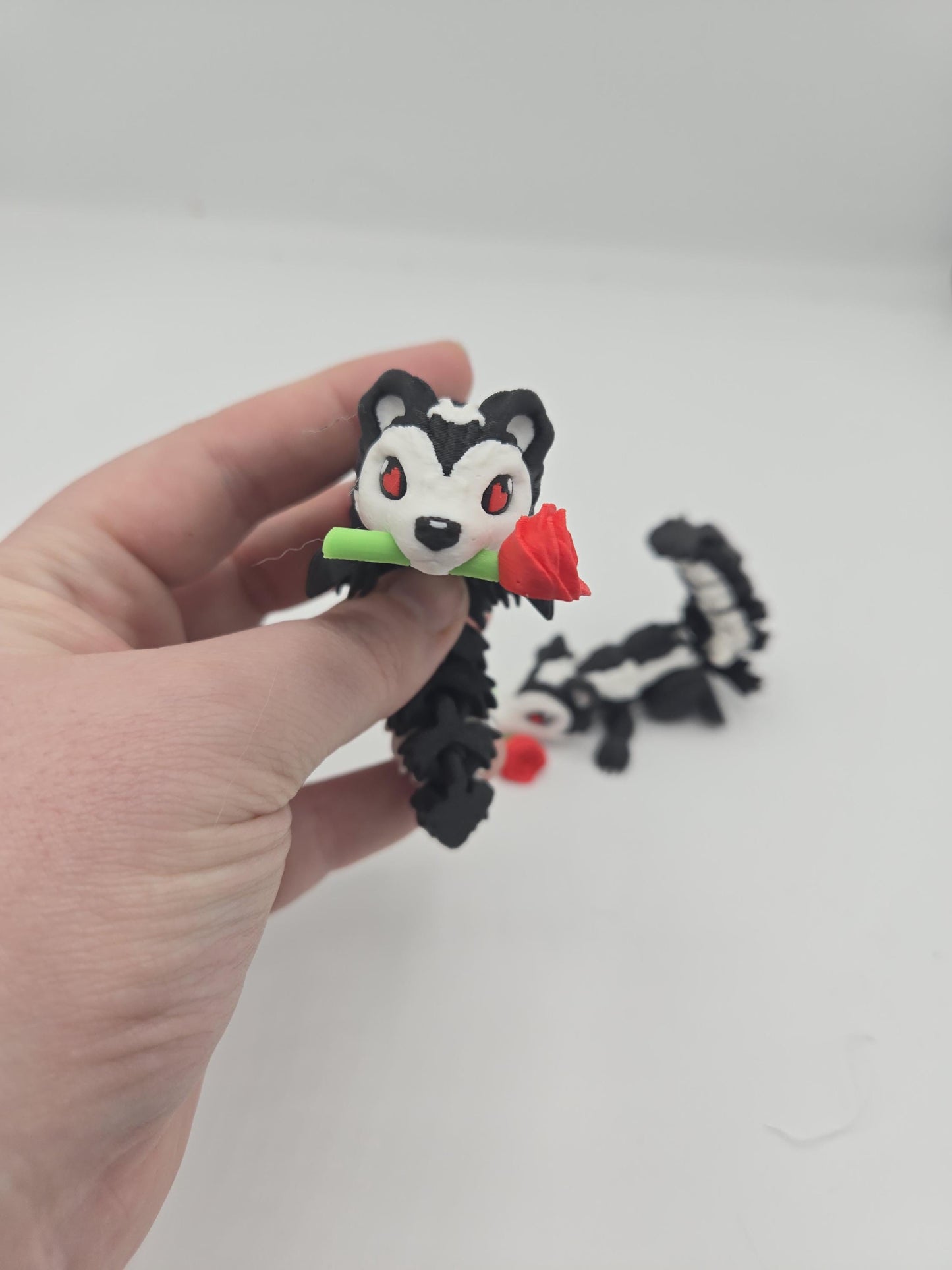 Flexi Cute Heart Eyes Flower Holding Skunk 3D Print