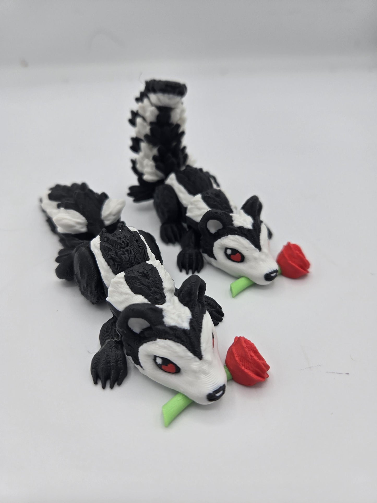 Flexi Cute Heart Eyes Flower Holding Skunk 3D Print