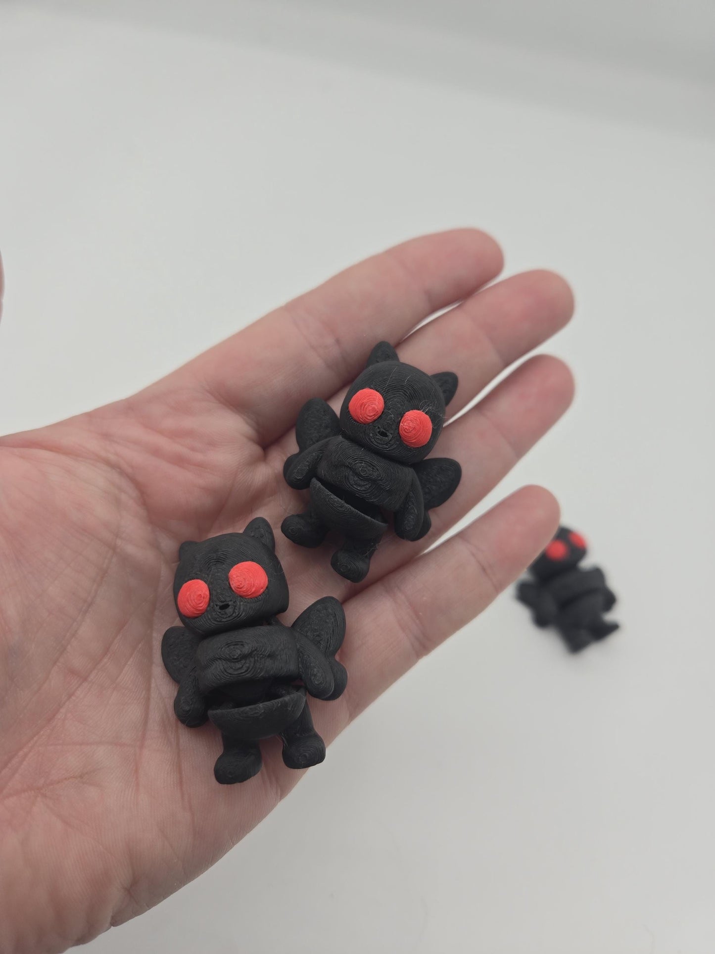 Mini Mothman cryptid figurine in multiple color options