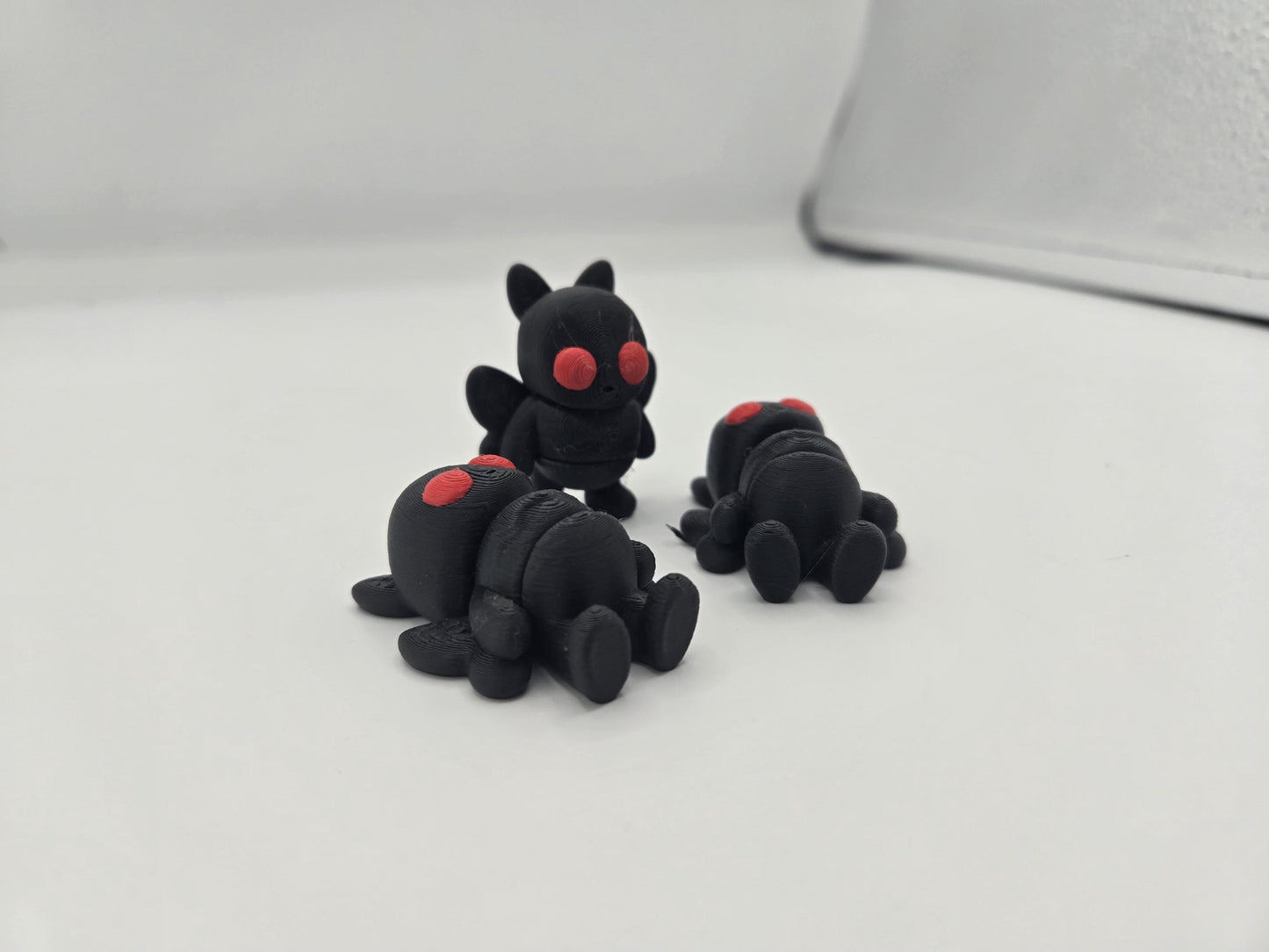 Close-up of mini Mothman face and detail at small scale