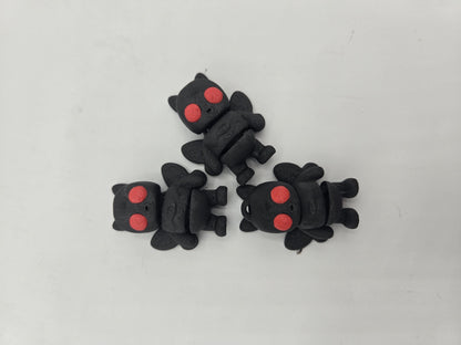 Tiny Mothman side view showing articulated mini wings