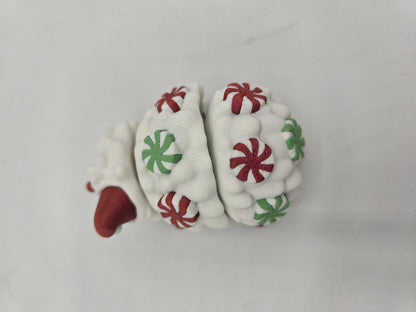 Peppermint Candies Christmas Hedgehog flexi, top-down view — flexible body segments covered in red and green candy swirls, 3D printed