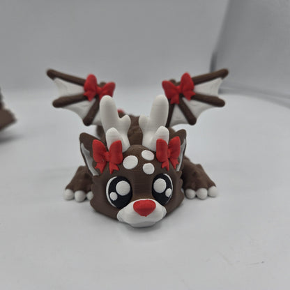 Dragon reindeer figurine on Christmas desk — dragon with antlers