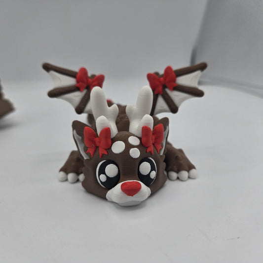 Dragon reindeer figurine on Christmas desk — dragon with antlers