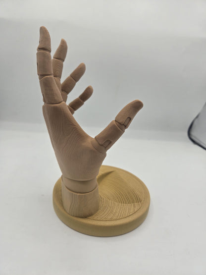 Side view of the empty wood-tone hand wine holder showing jointed finger detail and base dish