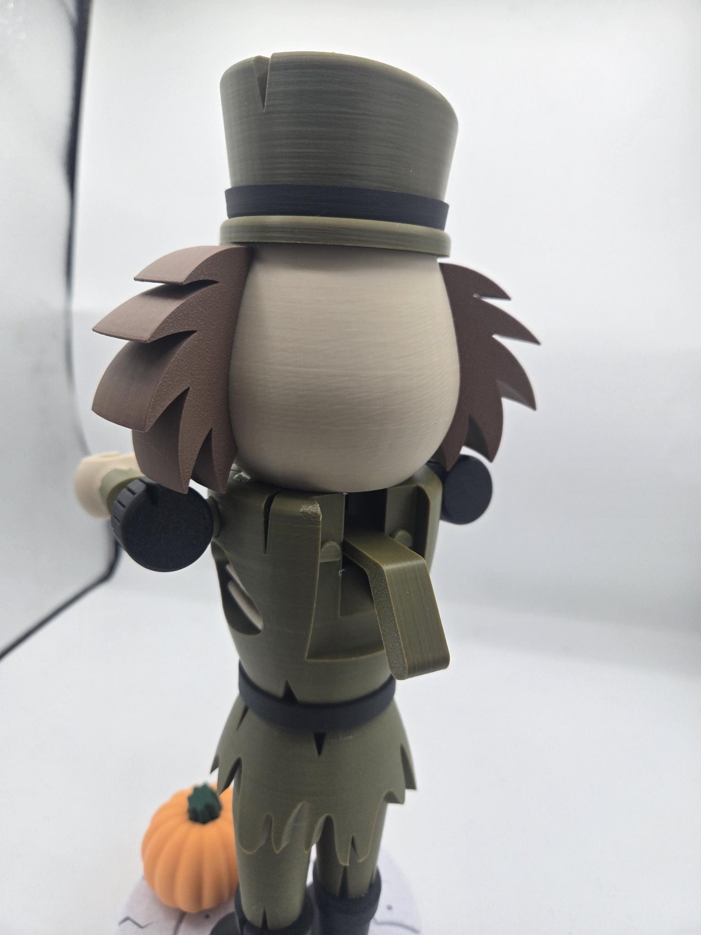Back view of the Halloween nutcracker showing wild hair, tall hat, and traditional jaw lever