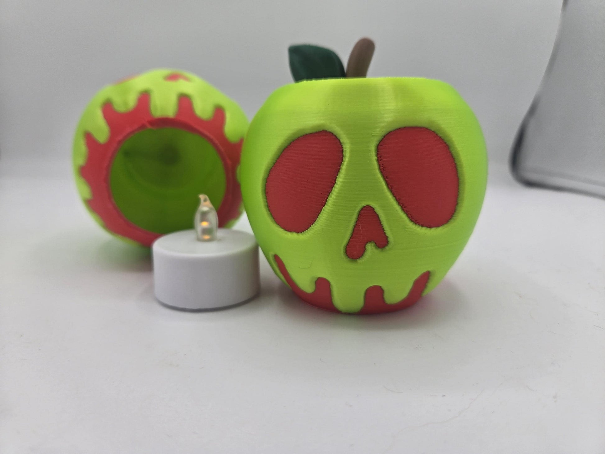 Hollow opening on the underside of the poison apple next to the battery-operated LED tealight