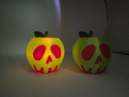 Green and red poison apple LED displays glowing side by side in low light