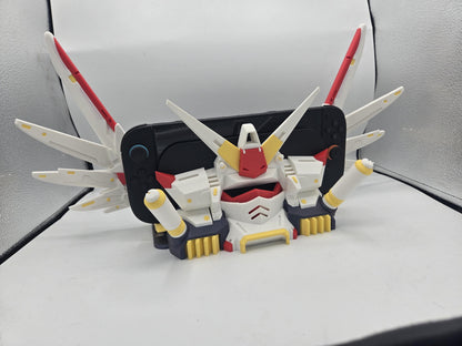 Mechdam Nintendo Switch 2 Dock Display in full anime launch pose — wings raised around the docked console, 3D printed in white, red, and yellow