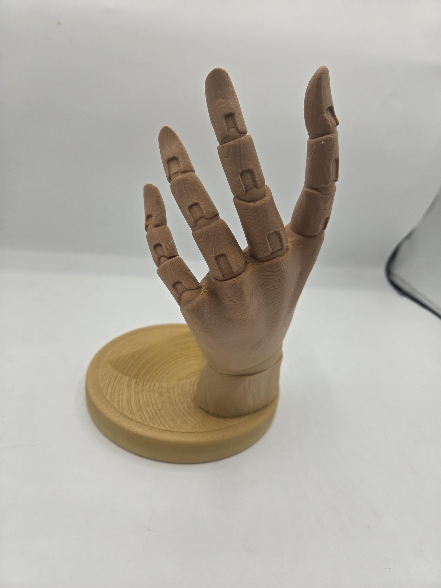3D printed hand sculpture with wood texture and jointed fingers spread, ready to hold a wine bottle