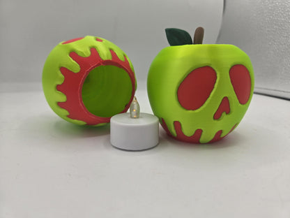 Poison apple shell tipped on its side showing the hollow interior and the included white LED tealight