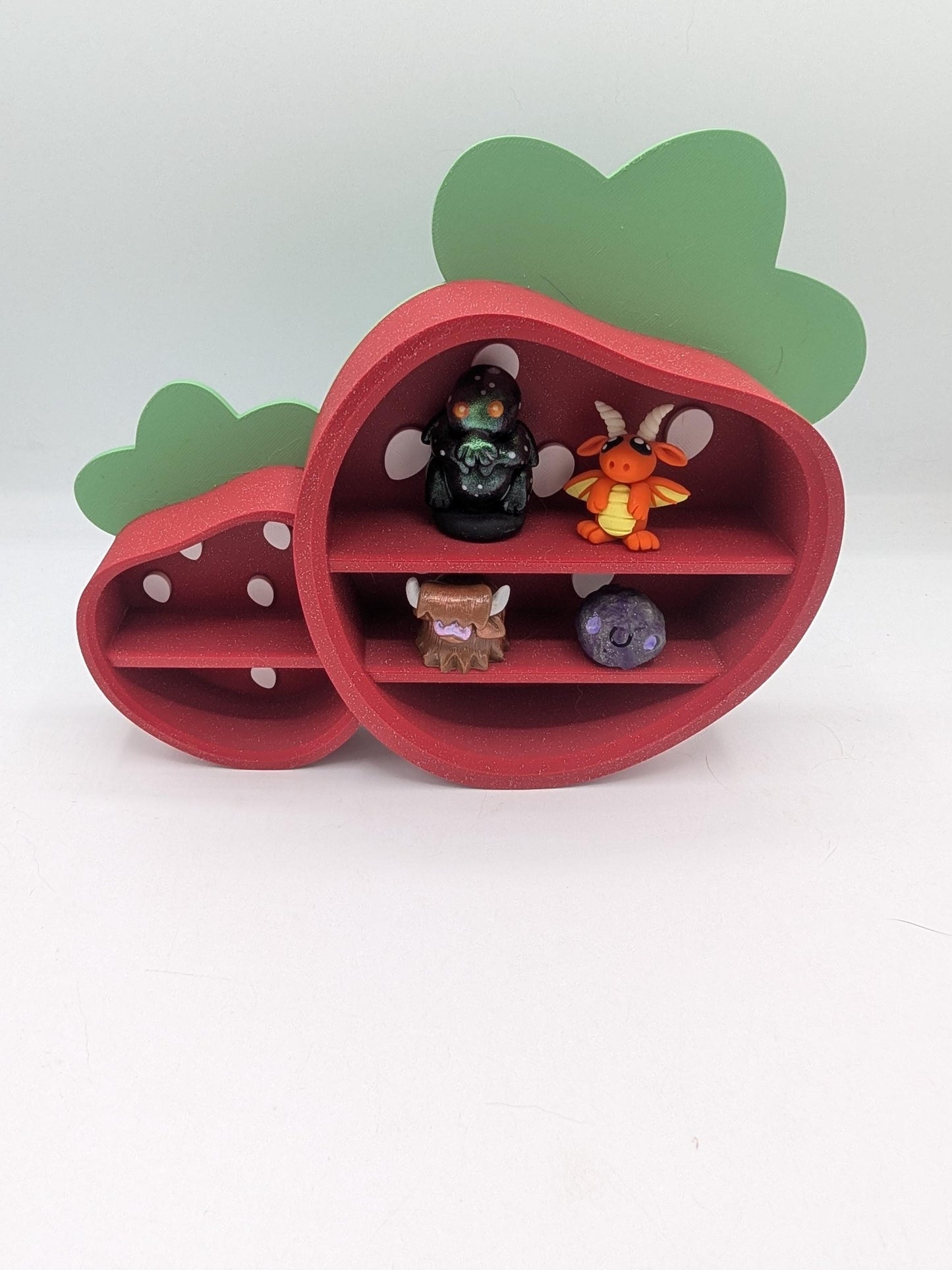 Strawberry Trinket Shelf styled with mini dragon and creature figures on its built-in shelves — 3D printed kawaii display decor