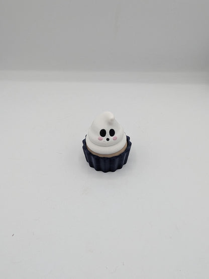 Front view of ghost cupcake clicker fidget with smiling ghost swirl and blushing cheeks