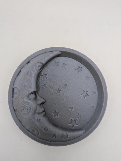 Celestial moon and star trinket tray 3D printed in shimmery Starlight Mercury gray — top view of raised crescent moon face and star details