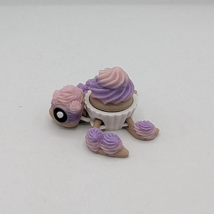 Close-up side view of cupcake turtle key clicker fidget with frosting details, 3D printed