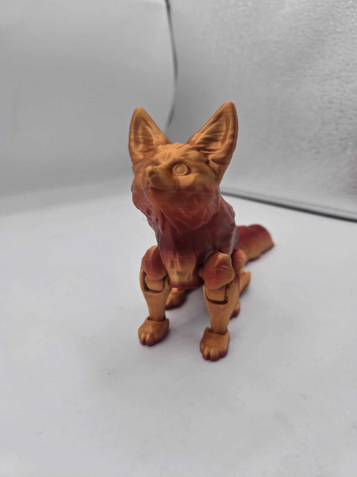 Close-up of seated fennec fox flexi figurine with large ears and sculpted face detail