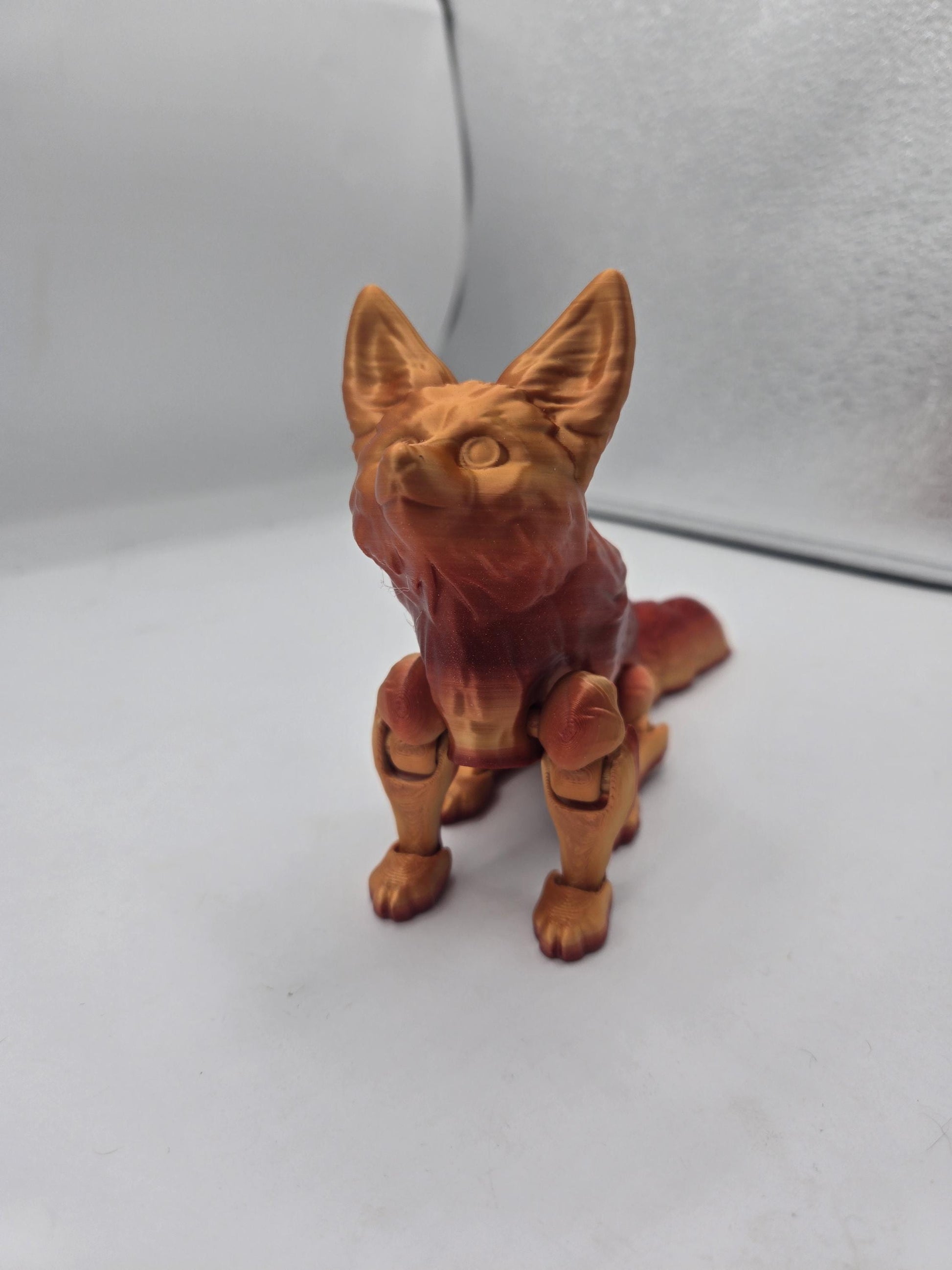 Close-up of seated fennec fox flexi figurine with large ears and sculpted face detail