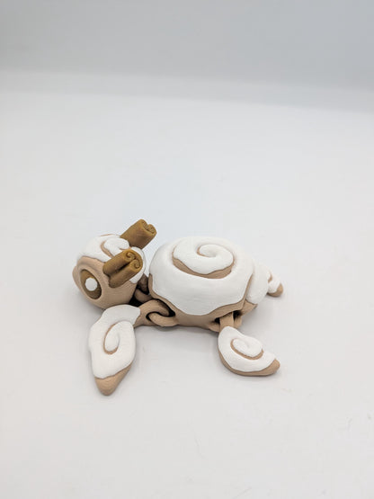Cinnamon Bun Turtle flexi 3D print side view showing cinnamon stick details on the head and articulated flippers