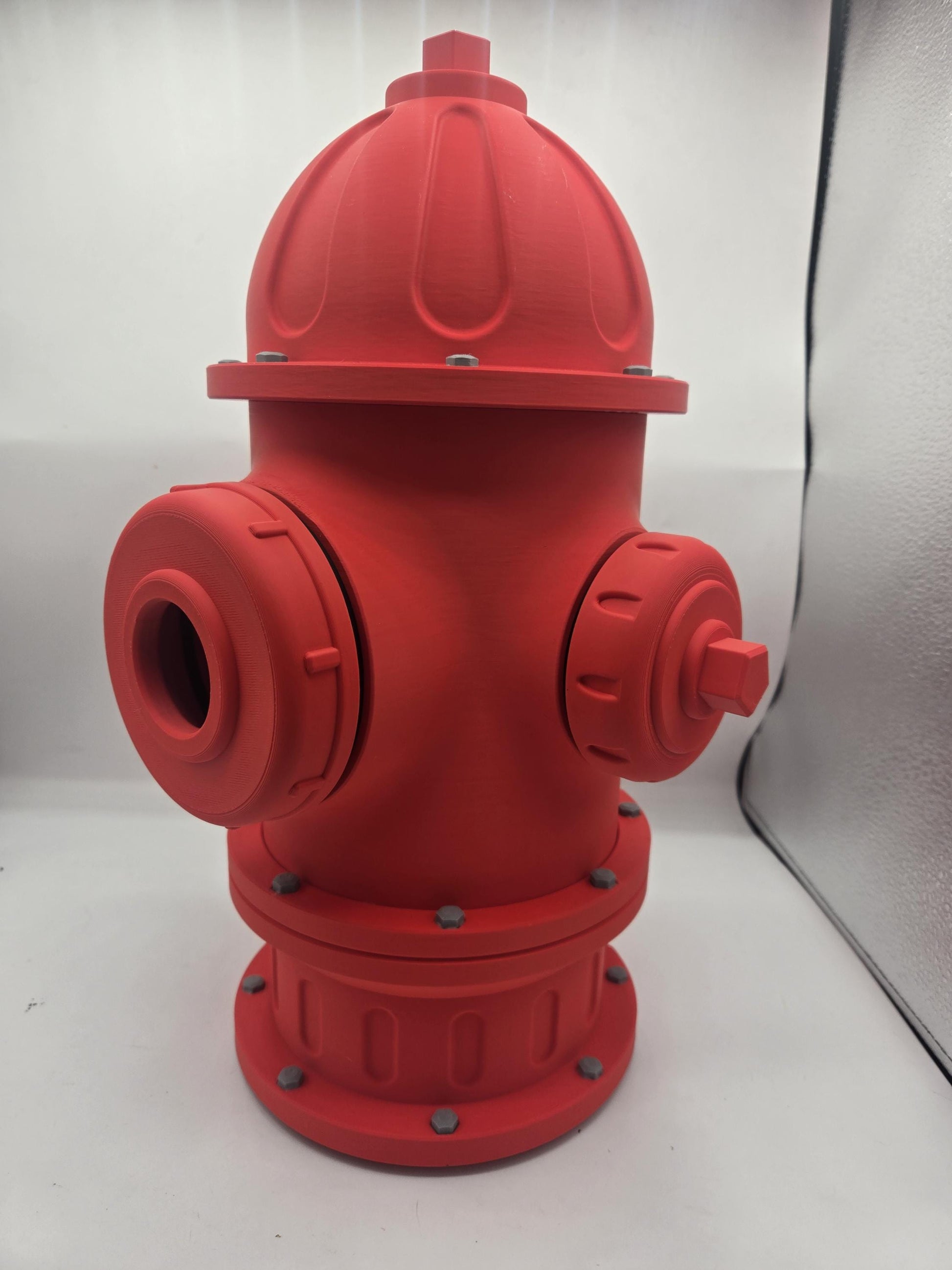Fire Hydrant Themed Bird House 3D print angled view showing dome cap, side outlets, and bolted base