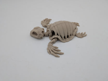 Articulated turtle skeleton flexi posed with bony flippers spread, viewed from the side, 3D printed