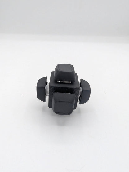 Angled view of black clicker cube key switch fidget showing keycaps and clear switch housings, 3D printed