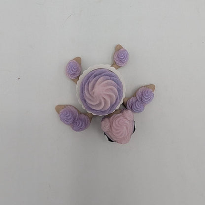 Top-down view of birthday cupcake turtle showing frosting swirl shell in white cupcake liner, 3D printed