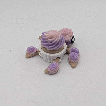 Angled rear view of cupcake turtle fidget showing swirled frosting shell and frosted flippers, 3D printed