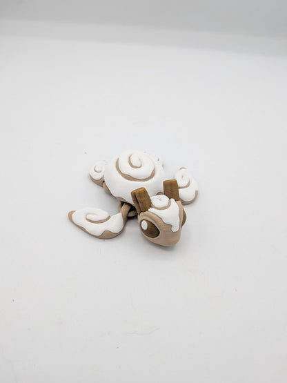Cinnamon Bun Turtle flexi 3D print top view — swirled white icing shell and cinnamon roll flippers