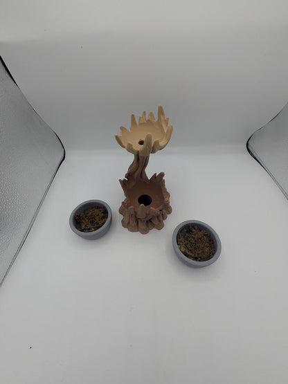 Spiral tree dual planter disassembled — the two removable gray bowls with faux moss beside the tree, showing the drainage opening in the base