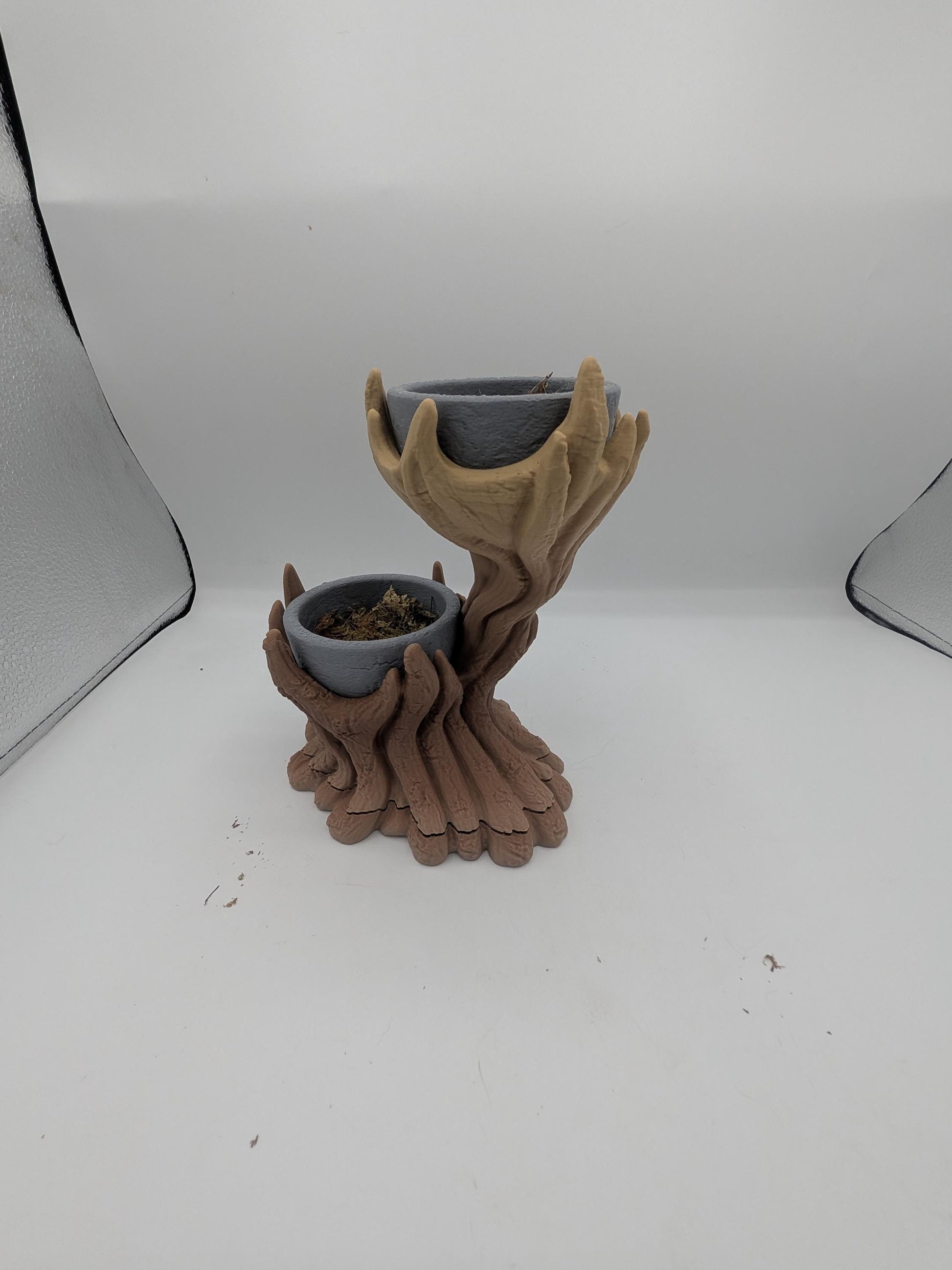 Spiral tree dual planter 3D print with twisting brown trunk and tan branches holding two gray planter bowls, lower bowl filled with faux moss