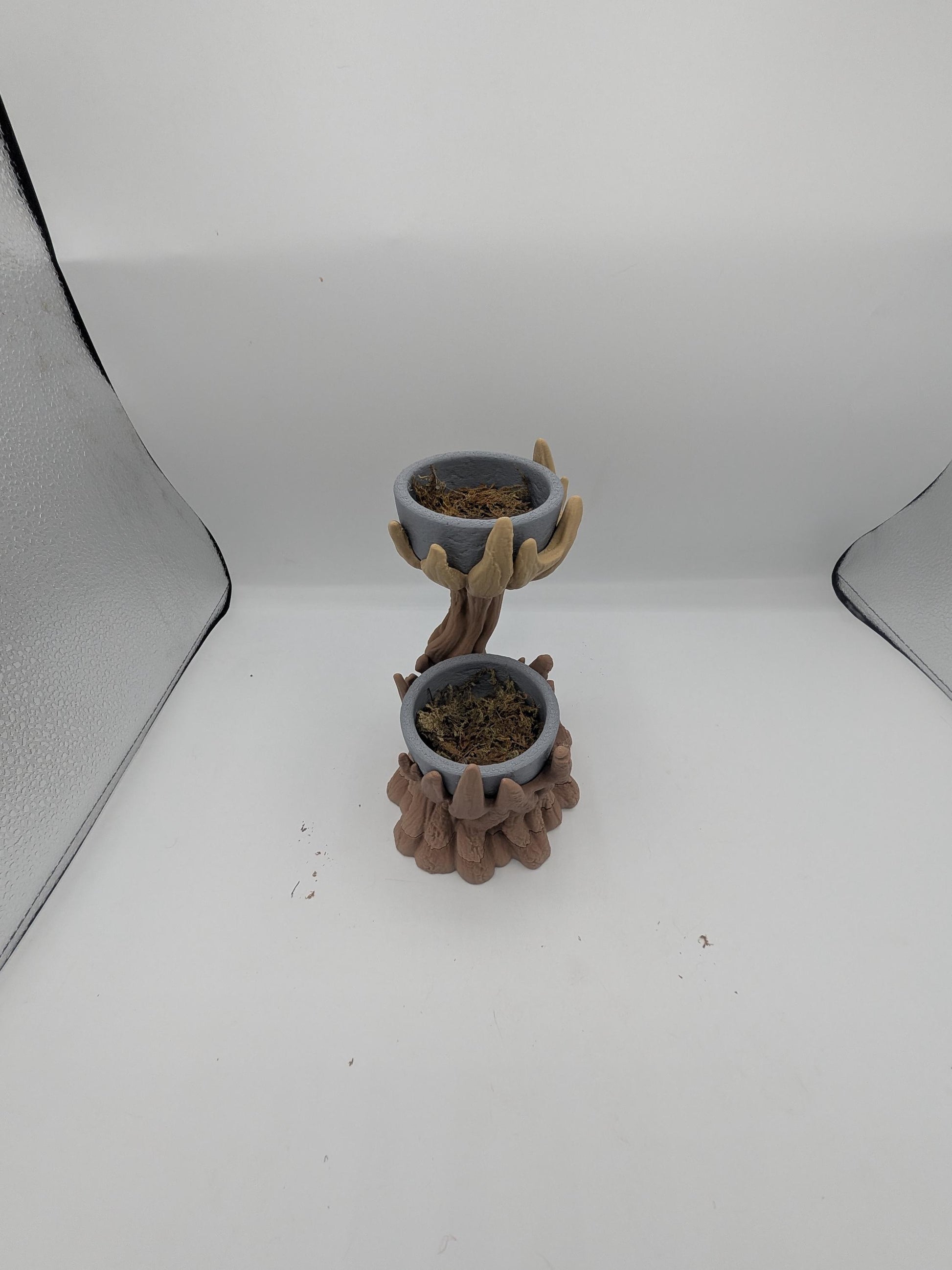 Spiral tree dual planter viewed from above with both gray bowls filled with faux moss for display inspiration