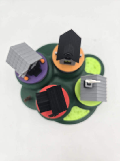 Top-down view of the Halloween mini village showing the rooflines of all four 3D printed tealight houses