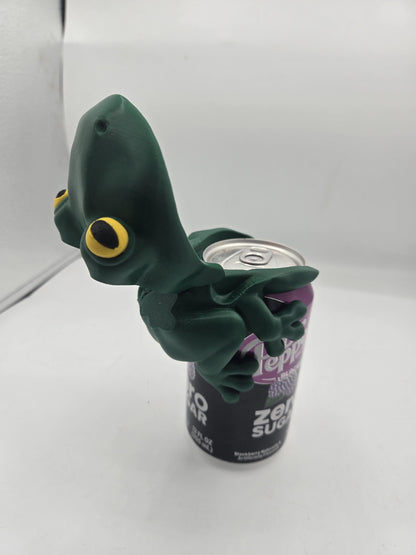 Frog Can Cover 3D print with the frog's mouth tilted open, exposing the can's drinking opening and pull tab while the legs stay clipped to the can
