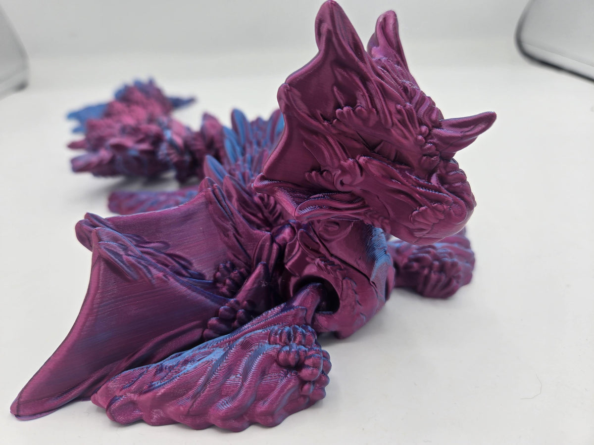 Ocean Sea Dragon flexi 3D print close-up of the sculpted head, horns, and layered fin details in Blue-Purple Dual silk PLA