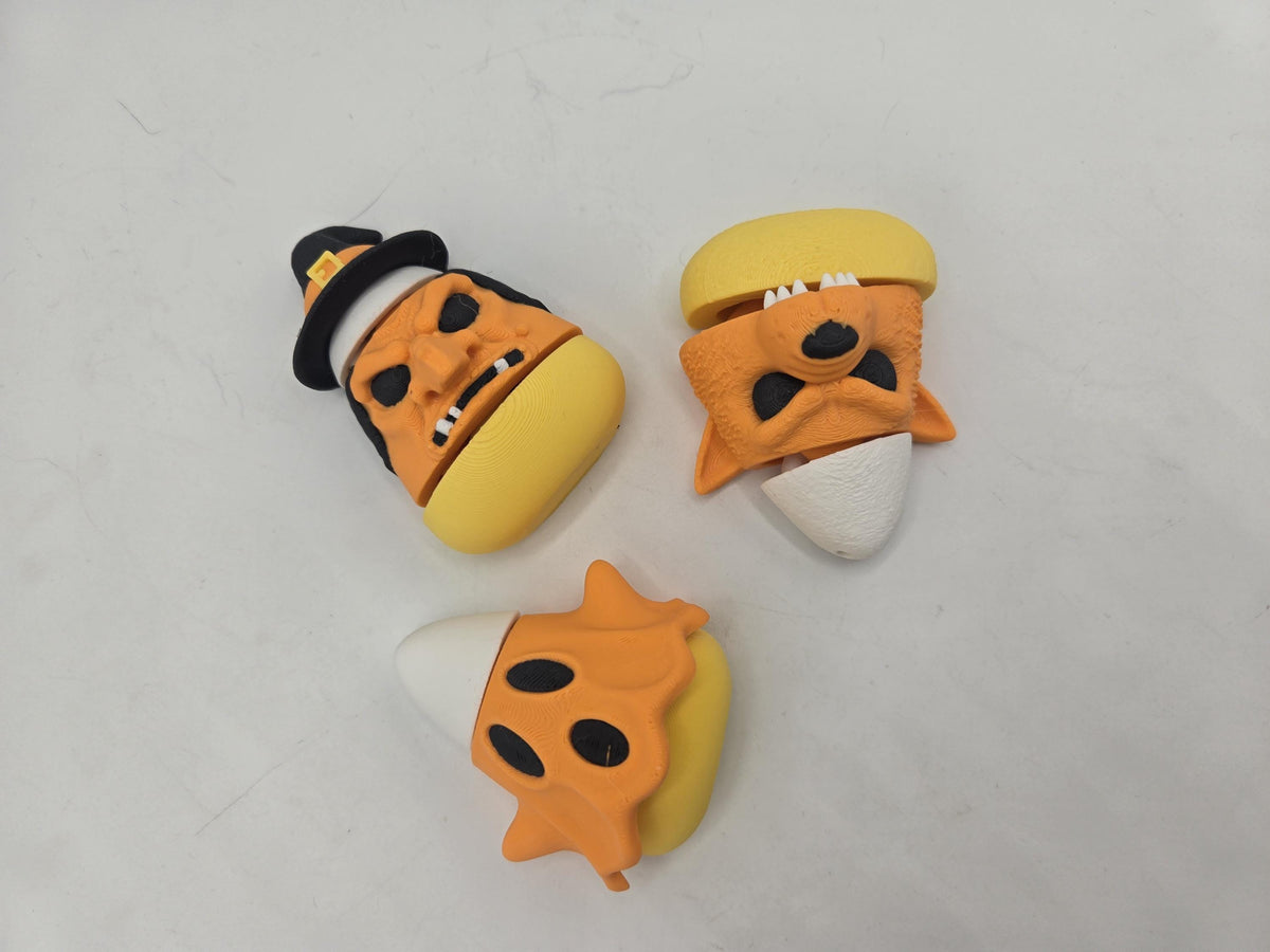 Candy Corn Monsters Halloween 3D print trio — witch, werewolf, and ghost candy corn figures viewed from above