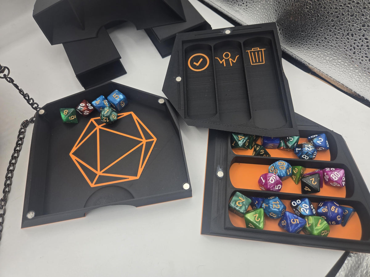 D20 Dice Shaped Purse 3D print TTRPG organizer insert close-up: black dice tray with orange D20 outline, dice tower, token tray with icon labels and a holder filled with polyhedral dice
