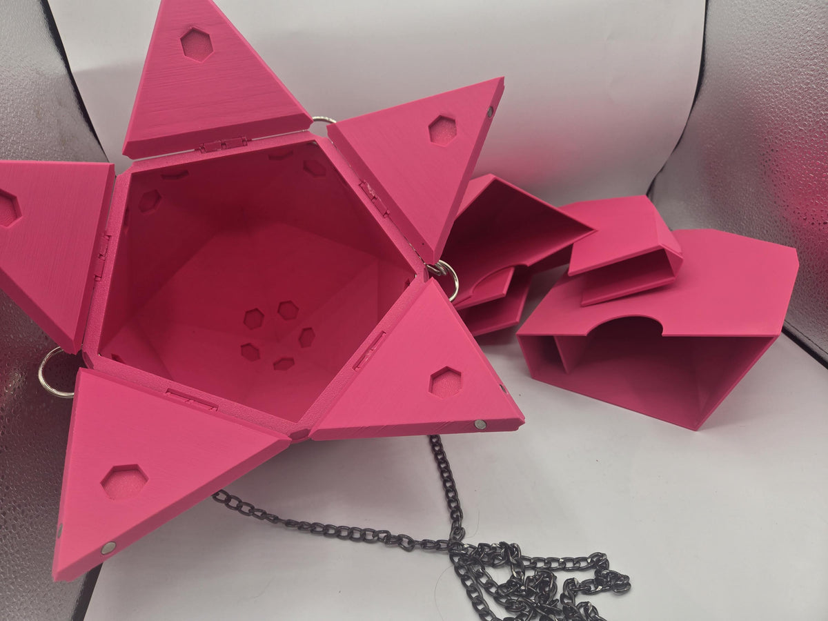 D20 Dice Shaped Purse 3D print in pink opened with its panels fanned out, the separate pink organizer insert pieces and black chain strap beside it